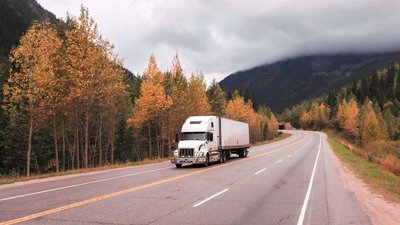 Semi Truck hauling a trailer on the highway